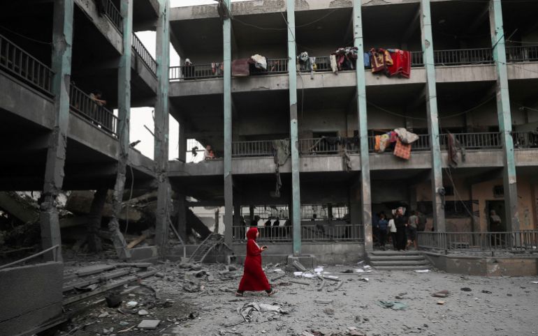 FILE PHOTO: Palestinians inspect the damage at a school sheltering displaced people, following an Israeli strike, in Jabalia refugee camp, in the northern Gaza Strip, May 12, 2025. REUTERS/Mahmoud Issa/File Photo