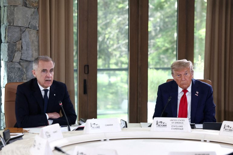 U.S. President Donald Trump and Canadian Prime Minister Mark Carney attend a meeting with G7 leaders and guests, at the G7 summit in Kananaskis, Alberta, Canada, June 16, 2025. REUTERS/Kevin Lamarque REFILE - CORRECTING ID FROM
