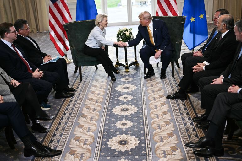TOPSHOT - US President Donald Trump (R) shakes hands with European Commission President Ursula von der Leyen (L) following their meeting, in Turnberry south west Scotland on July 27, 2025, on the third day of his visit to the country, since his second tenure as President began.