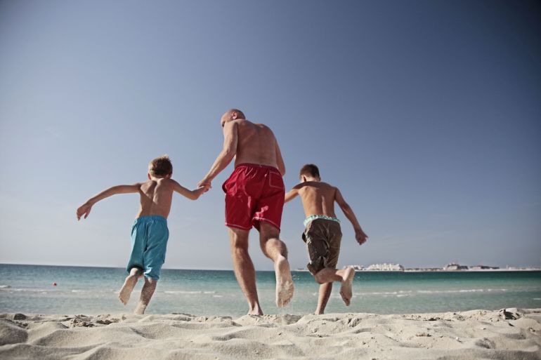 Family on vacation on the beach.