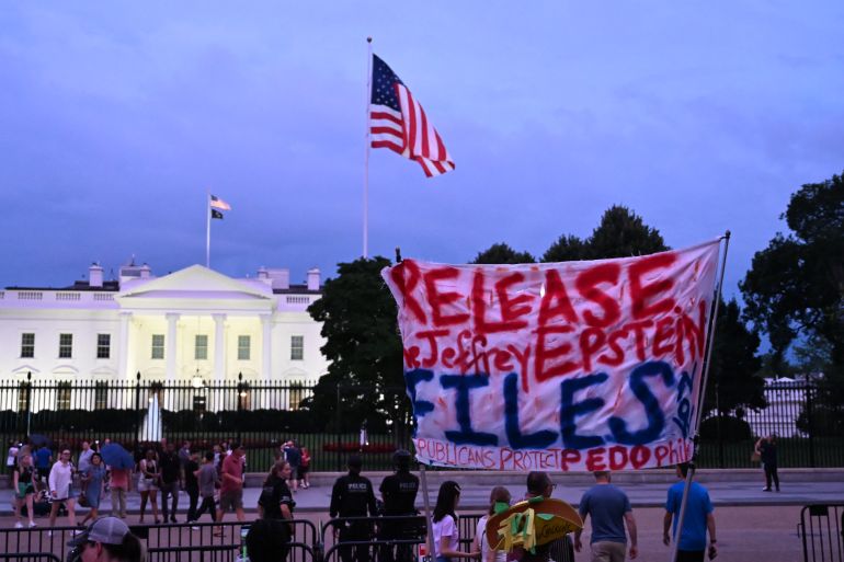 A protester holds a sign outside the White House demanding the release to all files related to Jeffrey Epstein in Washington, DC, on July 18, 2025.