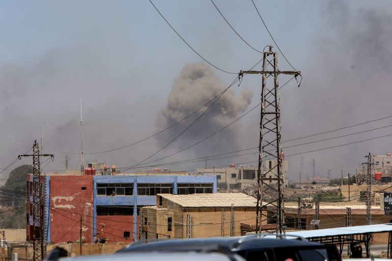 Smoke billows on the horizon during Israeli strikes near in the predominantly Druze city of Sweida on July 15, 2025, following clashes between Bedouin tribes and Druze fighters. Israel launched strikes on July 15 against Syrian government forces in the Druze-majority region of Sweida, saying it was acting to protect the religious minority. (Photo by Bakr ALKASEM / AFP)
