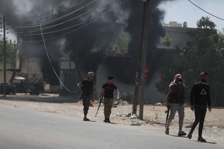 SWEIDA, SYRIA - JULY 18: Bedouin fighters are seen on the streets of al-Mazraa village in Syria's southern Sweida governorate on July 18, 2025 in Sweida, Syria. Fighting has flared up again between the Bedouin tribe and Druze sect in the southern Syrian province of Suwayda, as another ceasefire has collapsed a day after Syrian troops pulled out of the area. (Photo by Ali Haj Suleiman/Getty Images)
