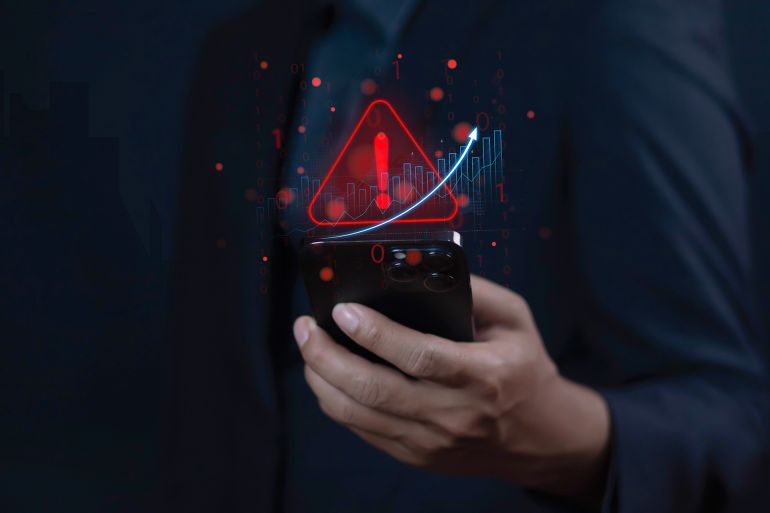 Exclamation mark in mobile system to warn of danger and risk of cyber attack on internet, malicious software for online login security on website.