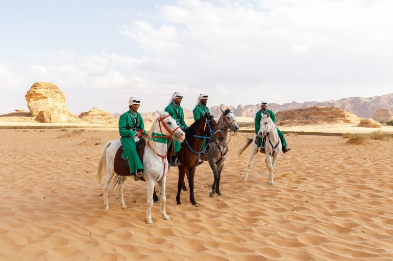 Al Ula, Saudi Arabia, February 19 2020: Horsemen in traditional costumes in Al Ula at the Tantora Festival in Saudi Arabia; Shutterstock ID 1951169209; purchase_order: aj; job: ; client: ; other: