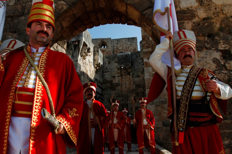 A Turkish folkloric group performs at Tripoli's citadel, northern Lebanon April 26, 2012, during an annual cermony to commemorate the 723rd anniversary of the liberation of the city from the Crusaders by the Mamluks. The group from Istanbul, performed a traditional show inspired by the Ottoman period, as they marched from Tripoli's citadel to the old souk. REUTERS/Omar Ibrahim (LEBANON - Tags: SOCIETY ANNIVERSARY) مماليك