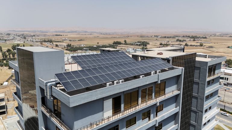A drone view shows solar panels at Al Noor University, that are used to generate electricity, which has been in high demand recently, in Mosul, Iraq, July 24, 2025. REUTERS/Khaled Al-Mousily
