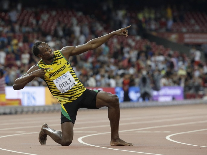Jamaica's Usain Bolt celebrates after winning the men’s 200m final at the World Athletics Championships at the Bird's Nest stadium in Beijing, Thursday, Aug. 27, 2015. (AP Photo/David J. Phillip)
