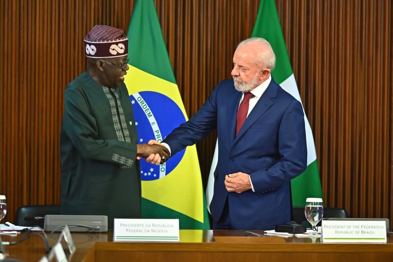 BRASILIA, BRAZIL - AUGUST 25: President of Brazil, Lula Da Silva, welcomes President of Nigeria, Bola Tinubu, during an official visit to Brazil at Planalto Palace on August 25, 2025 in Brasilia, Brazil. (Photo by Ton Molina/Getty Images)