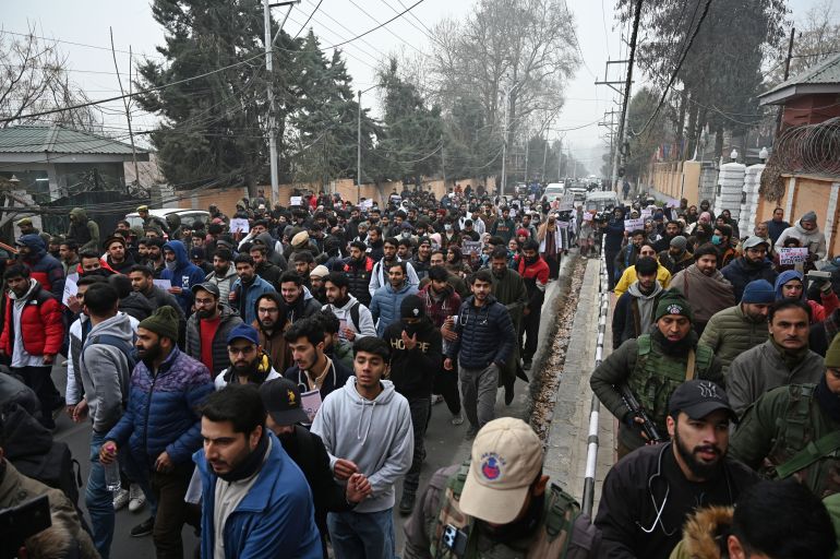 SRINAGAR, INDIA - DECEMBER 23: Students take part in a protest outside the chief minister's residence to demand rationalisation of reservation policy as per population proportion, on December 23, 2024 in Srinagar, India. The ruling National Conference MP Aga Ruhullah led the protest which was joined by students, including medical students, from the open merit category and leaders of other political parties. The reservation policy for jobs and admissions was introduced by the lieutenant governor-led administration before the assembly elections earlier this year. (Photo by Waseem Andrabi/Hindustan Times via Getty Images)