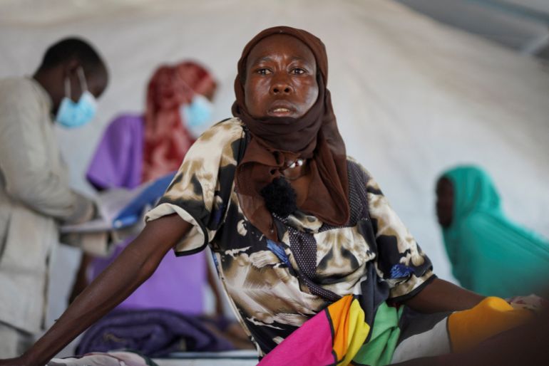 Halima Mohammed Adam, a Sudanese cholera patient, looks on as she sits on a bed at a United Nations-Run makeshift clinic, in Tawila north Darfur, Sudan, August 5, 2025. REUTERS/Mohammed Jamal